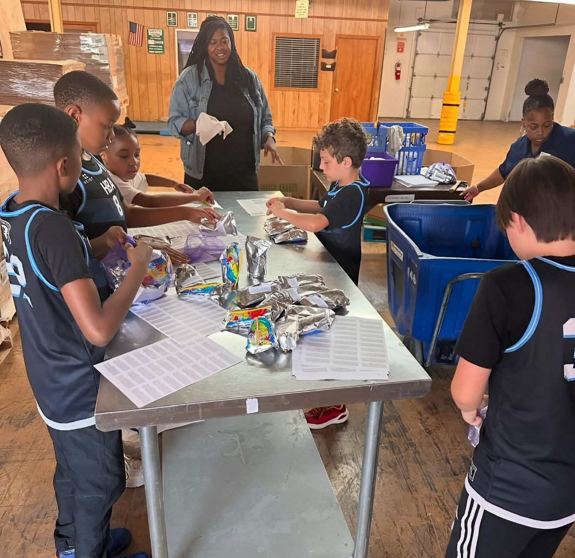 HBA players packing items at Food Bank at Durham